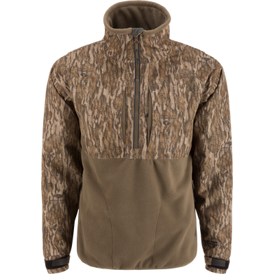 MST CommandXT Eqwader Half Zip Jacket with camo-patterned upper, olive fleece lower, zippered chest pockets, storm flap, and adjustable cuffs, ideal for rugged outdoor use.