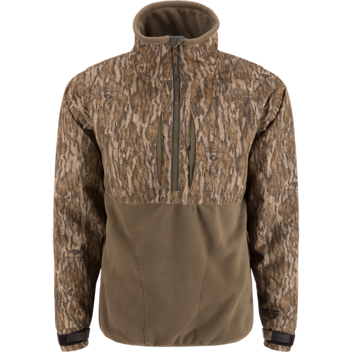 MST CommandXT Eqwader Half Zip Jacket with camo-patterned upper, olive fleece lower, zippered chest pockets, storm flap, and adjustable cuffs, ideal for rugged outdoor use.