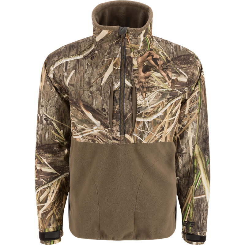 MST CommandXT Eqwader Half Zip Jacket with camo print upper, olive-brown fleece lower, zippered chest pockets, and adjustable cuffs, designed for waterproof and windproof protection.