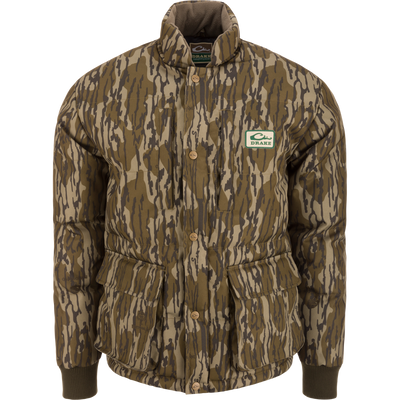 Throwback 80 Featherless Puffer Jacket with woodland camo, snap-button closure, ribbed cuffs, and large flap pockets, designed for outdoor enthusiasts and hunting.