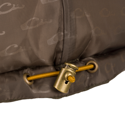 Close-up of the Throwback 80 Featherless Puffer Vest featuring a durable antique brass metal zipper, showcasing its high-quality waterproof and windproof polyester material.