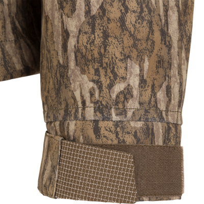 Close-up of the LST Hardline 3-in-1 Jacket's camo cuff with adjustable Velcro strap, showcasing its durable, adaptable design for hunting and outdoor use.
