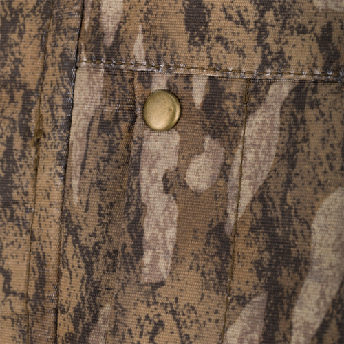 Close-up of a brass snap on camo fabric from the LST Hardline 3-in-1 Jacket, showcasing durable construction and functionality for versatile hunting conditions.