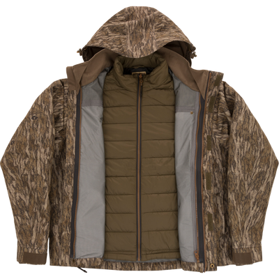 LST Hardline 3-in-1 Jacket featuring a tree-bark camo shell with hood and an olive-green quilted liner, designed for adaptable, high-quality hunting protection.