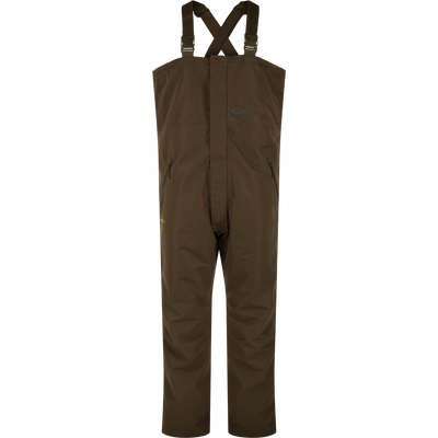 LST Hardline Insulated Bib, waterproof chest-high overalls with adjustable straps, zippered pockets, and articulated knees, designed for warmth and mobility in harsh environments.