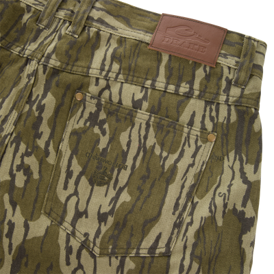 Close-up of the Throwback80 Field Pant's back waistband and pocket, showcasing belt loops, a riveted pocket, and a DRAKE leather patch, emphasizing durability and classic style.