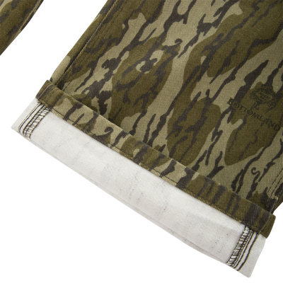 Close-up of the Men's Throwback80 Field Pant hem, showcasing durable triple-needle stitching on heavyweight cotton twill, reflecting rugged quality and craftsmanship.