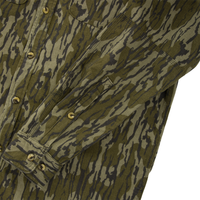 Throwback 80 Field Shirt in tiger-stripe camouflage, showcasing front buttons, chest pockets, and durable triple-stitched seams, ideal for rugged outdoor use.