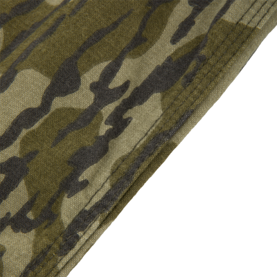 Close-up of the Throwback 80 Field Shirt's camouflage fabric, highlighting triple-needle stitching for durability, reflecting its rugged design for hunting and outdoor activities.