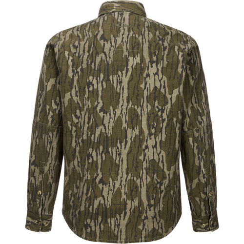 Throwback 80 Button Down Shirt in olive-gray camouflage, showcasing durable cotton twill, double-layered forearms, and triple-stitched seams, ideal for rugged outdoor activities.