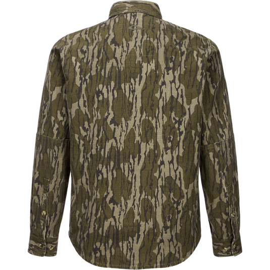 Throwback 80 Button Down Shirt in olive-gray camouflage, showcasing durable cotton twill, double-layered forearms, and triple-stitched seams, ideal for rugged outdoor activities.