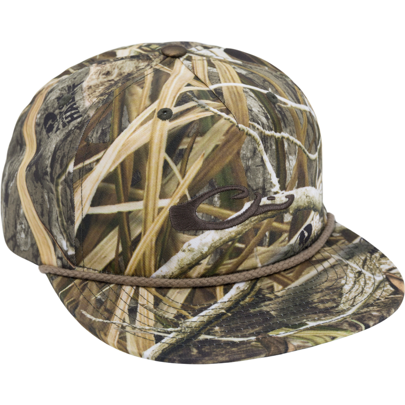 Drake X Richardson 256XE Flatbill Cap with marsh-grass camo, five-panel design, braided rope detail above flat brim, and stitched logo on front.