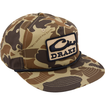 Drake X LOST Goat Rope Cap with camo pattern, woven Drake patch, and unique 550 paracord detail, embodies rugged style and adjustable comfort.