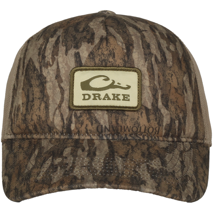 Foam Trucker Logo Cap featuring camo pattern, curved brim, Drake logo patch, foam front, and mesh back for breathability and comfort.