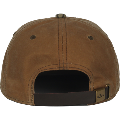 Back view of the Waxed Flatbill Ball Cap, showcasing its unstructured design, adjustable leather strap, and waxed canvas fabric for a stylish, comfortable fit.