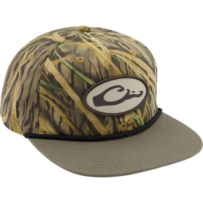 Drake X Lost Hat Hybrid Goat Rope Cap features a camo pattern, oval C patch, cord detail, and adjustable snap-back for a stylish and durable fit.