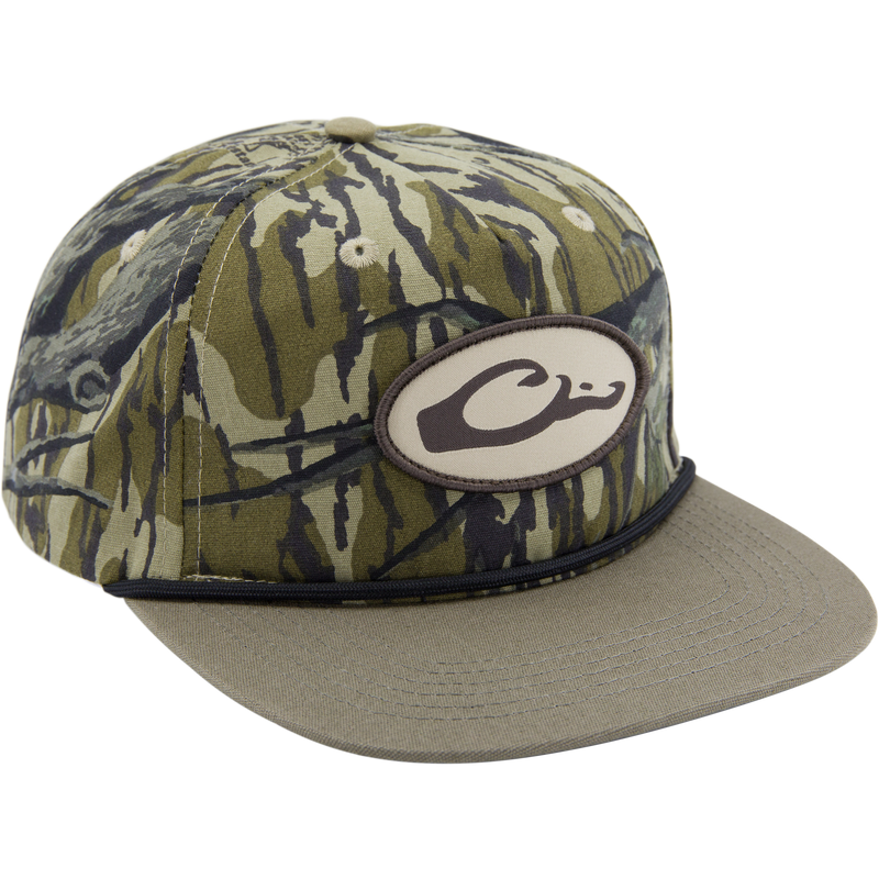 Drake X Lost Hat Hybrid Goat Rope Cap featuring woodland-camo pattern, oval C logo patch, olive brim, and snap-back closure for adjustable fit.