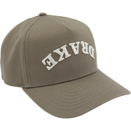 Drake X Lost Hat Easy 5 Panel Cap, olive-green with curved bill and snapback, features “DRAKE” embroidery, blending cotton-polyester for style and comfort.