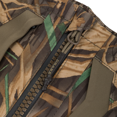 Close-up of the BMF Uninsulated Pit Bib, showcasing its camo-patterned fabric, heavy-duty zipper, and reinforced seams, designed for durable, waterproof protection in harsh conditions.