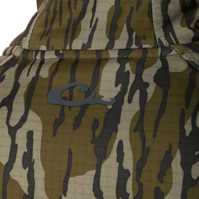 Camouflage fabric of Grid Fleece Half Zip Hoodie, featuring visible stitching, pocket seam, and dark-gray C logo, highlighting its durable, moisture-wicking design.