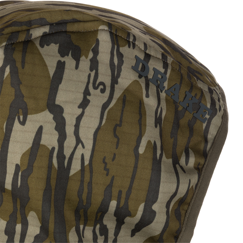 Close-up of the Grid Fleece Half Zip Hoodie with DRAKE logo, showcasing its camouflage pattern and moisture-wicking, stretchable fleece material for hunting comfort.