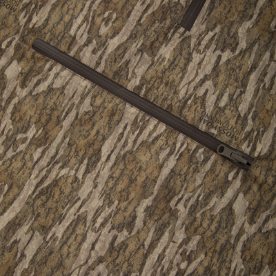RTL - El Poncho in Mossy Oak Bottomland camo with taped seams and water-resistant zippers, showcasing durable ripstop fabric and adjustable features for hunting versatility.