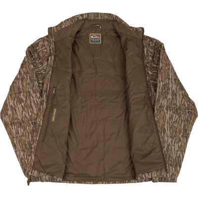 MST Synthetic Down Pack Jacket with horizontal baffle design, zippered pockets, and reinforced elbow patches. Lightweight, packable, and adjustable waist for versatile use.