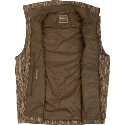 MST Synthetic Down Pack Vest with reinforced elbow patches, zippered slash pockets, and drawcord adjustable waist, designed for versatile warmth and packability.