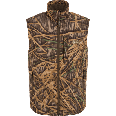 MST Synthetic Down Pack Vest with camouflage pattern, featuring a zipper, abrasion-resistant shell, adjustable waist, and packable design, ideal for versatile hunting and outdoor use.