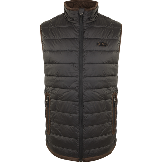 A black durable Synthetic Double Down Vest from Drake Waterfowl, featuring a horizontal baffle design, 160g synthetic down insulation, suede accents, and reverse coil zippers. Ideal for cold days.