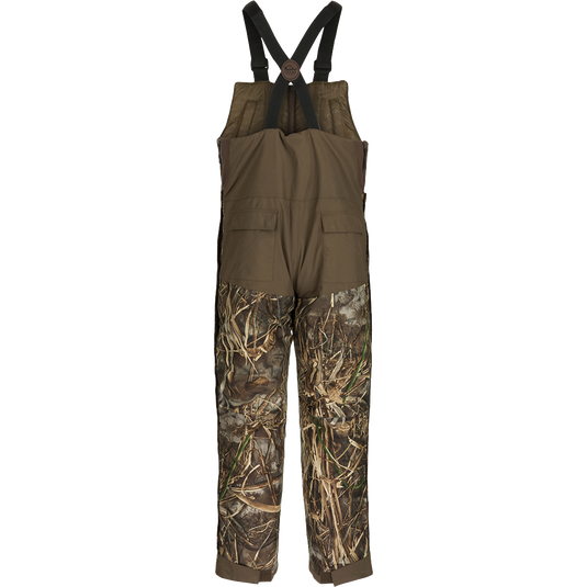 A pair of LST Insulated Bib 2.0 with full-length zippers on each side for easy removal. Features include hand warmer pockets and reinforced knees.