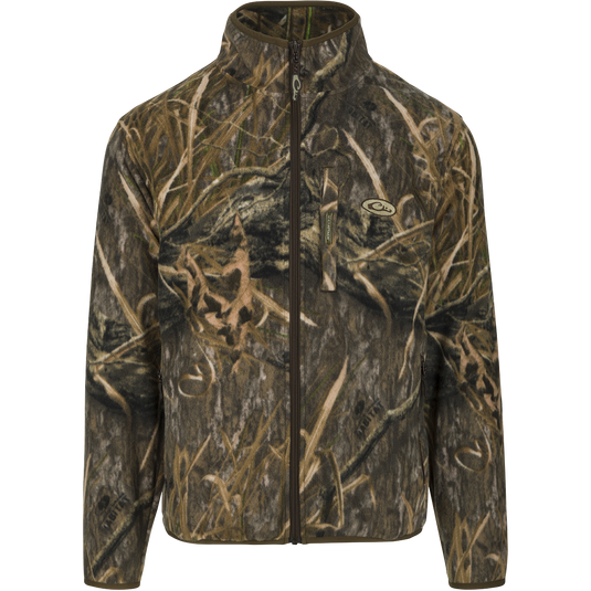 MST Camo Camp Fleece Full Zip Jacket: Midweight, versatile jacket for cool fall days or layering in extreme cold hunts. Features Magnattach™ pocket and zippered slash pockets for secure storage and warmth. Made of 100% polyester micro-fleece with anti-pill treatment and moisture-wicking properties.