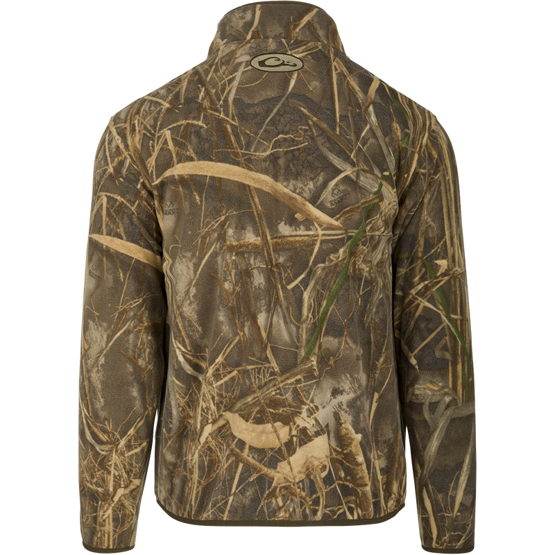 A midweight MST Camo Camp Fleece Full Zip Jacket with a camouflage pattern. Versatile for cool fall days or layering in extreme cold conditions. Features Magnattach™ pocket and zippered slash pockets for secure storage and warmth.