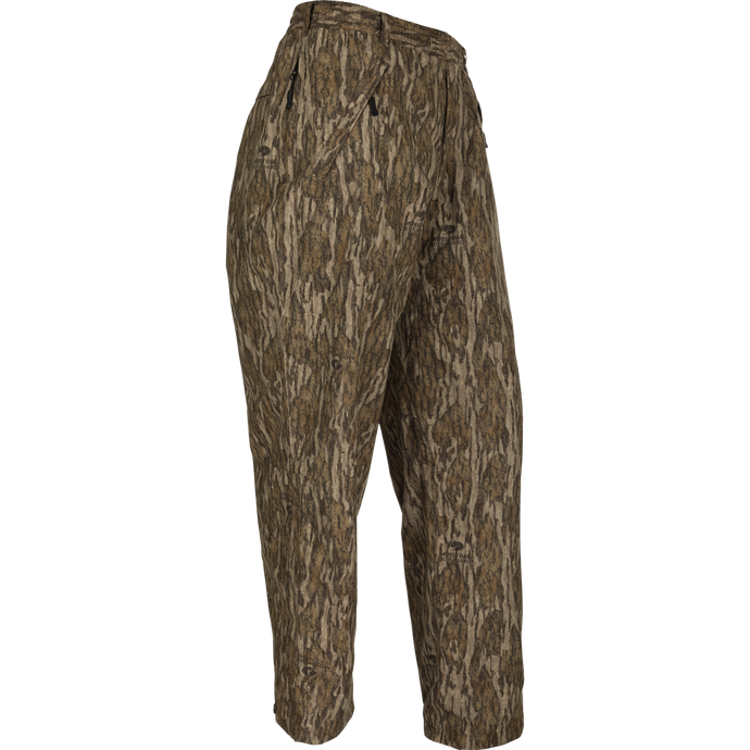 A pair of camouflage pants designed for hunters needing total waterproof protection. The EST Waterproof Over Pant works flawlessly with other layers, providing a barrier against the elements. Match with our EST Heat-Escape Full Zip or 1/4 for complete lightweight rain gear.