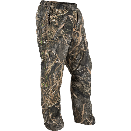 A pair of EST Waterproof Over Pants, designed for hunters needing total waterproof protection. Cut generously for layering, these pants create a barrier against the elements. Match with our lightweight rain gear for a complete set.