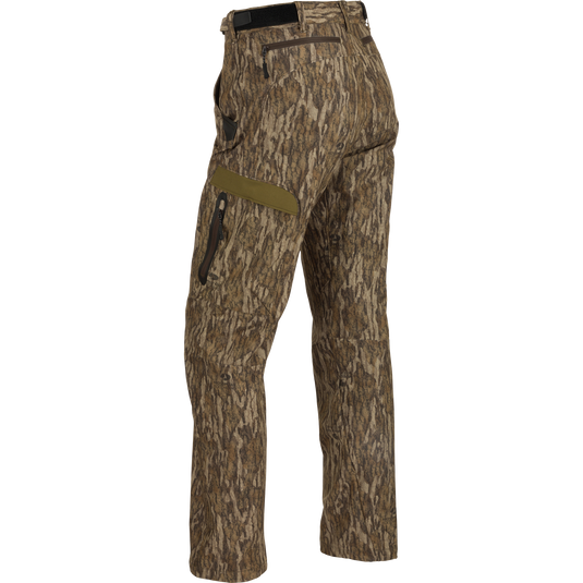 A pair of lightweight, versatile Women's EST Camo Stretch Tech Pants made from 100% polyester. Features adjustable waistband, multiple pockets, and elastic ankle cinch cord. Perfect for hunting and outdoor activities.