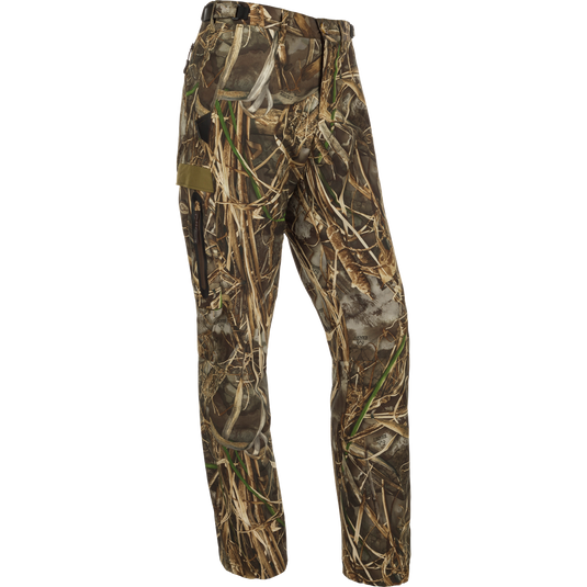 A pair of lightweight, versatile Youth EST Camo Stretch Tech Pants made from 100% polyester. Features adjustable waistband, multiple pockets, and elastic ankle cinch cord. Perfect for hunting and outdoor activities.