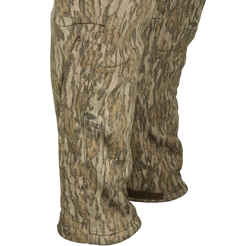 MST Ultimate Wader Pants - Old School: Camouflage pants with adjustable ankle fit for wearing under waders or as casual pants. Side-elastic waist, silicone grip waistband, 4-way stretch, gusseted crotch, and zippered rear security pockets.