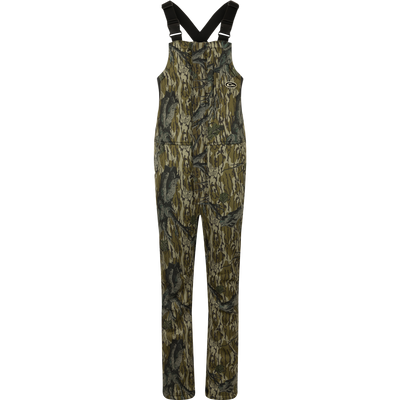 MST Ultimate Wader Bib: Camouflage overalls with straps, 4-way stretch, gusseted crotch, and articulated knees for easy movement. Sherpa-lined slash handwarmer pockets, Magnattach™ chest pocket, and zippered rear security pockets for storage. Ankle-fit for under waders.
