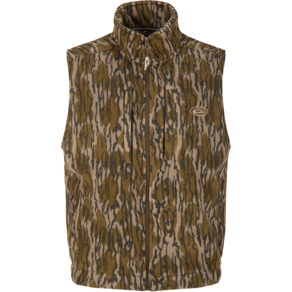 The MST Windproof Layering Vest by Lifestyle is a sleeveless, zip-up layering vest in brown, tan, and black camo with water-resistant fleece and a small embroidered chest logo.