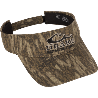 Drake Logo Visor with camouflage pattern, featuring an embroidered logo and adjustable Velcro closure, designed for hunting and outdoor activities.
