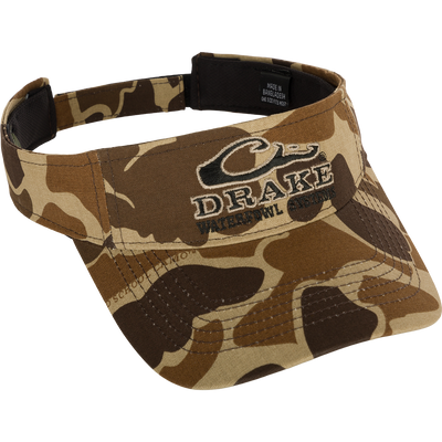 Drake Logo Visor with camouflage pattern and embroidered Drake Waterfowl Systems logo on the front. Velcro back closure. Made of 100% cotton (solid colors) and 100% polyester (camo colors). Lightly structured front panels. One size fits most.