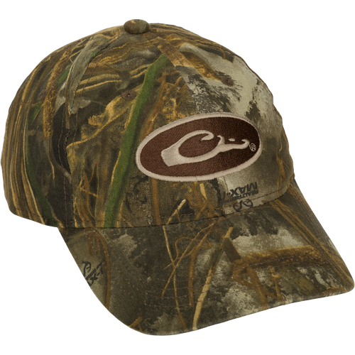Camo Cotton Cap - Realtree: A lightweight cotton cap with camo concealment under the bill to reduce glare. Features a six-panel construction and a hook and loop closure.