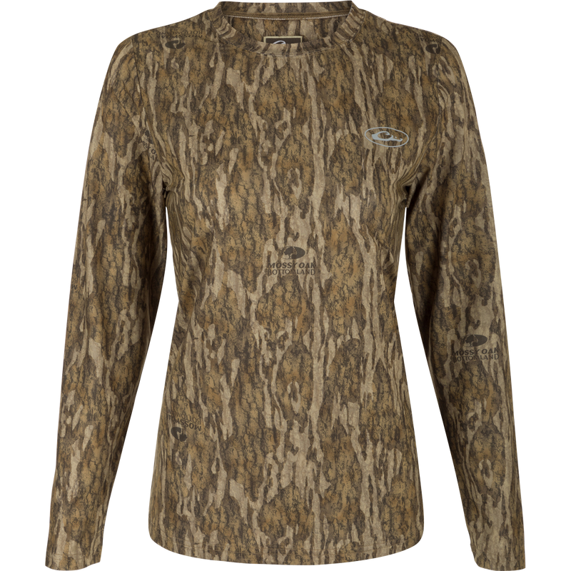 Women's EST Camo Performance Long Sleeve Crew, a shirt with a tree pattern. Made of 92% Polyester/8% Spandex for comfort and 4-Way Stretch for flexibility. Features Shield 4 Sun™ UPF 50+, Shield 4 Coolant™, Shield 4 Odor™, and Shield 4 Stains™ treatments for outdoor activities.