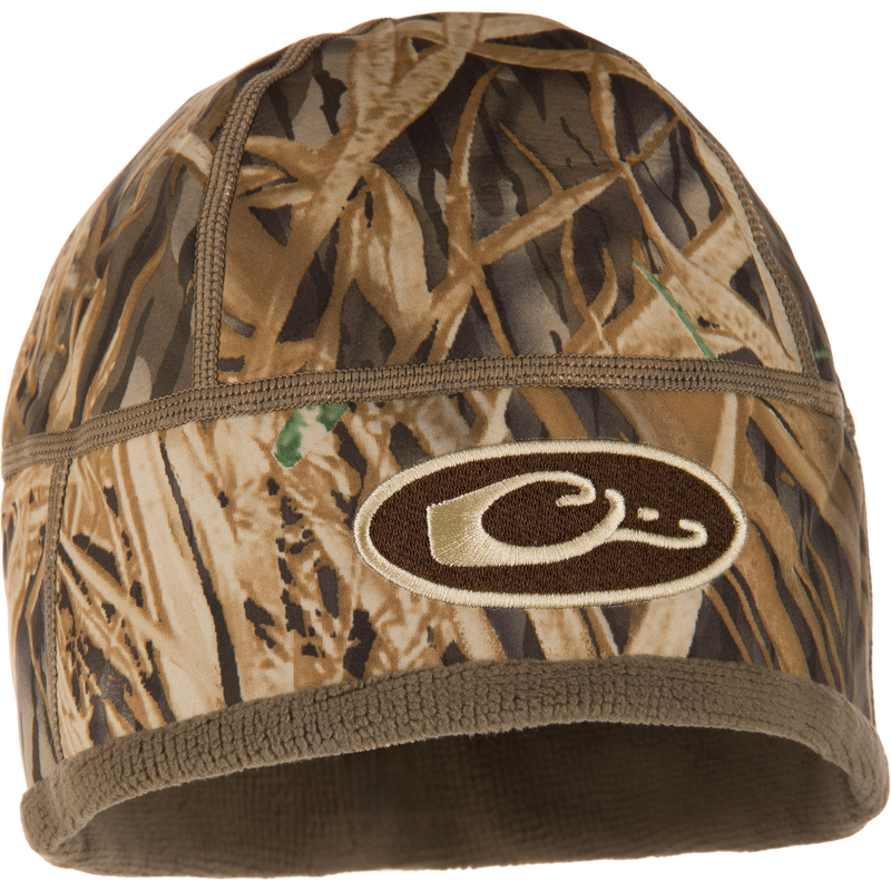 Camouflage-patterned MST Windstopper Beanie with embroidered C logo, designed for warmth with windproof Gore-Tex membrane and fleece lining, covering the ears.