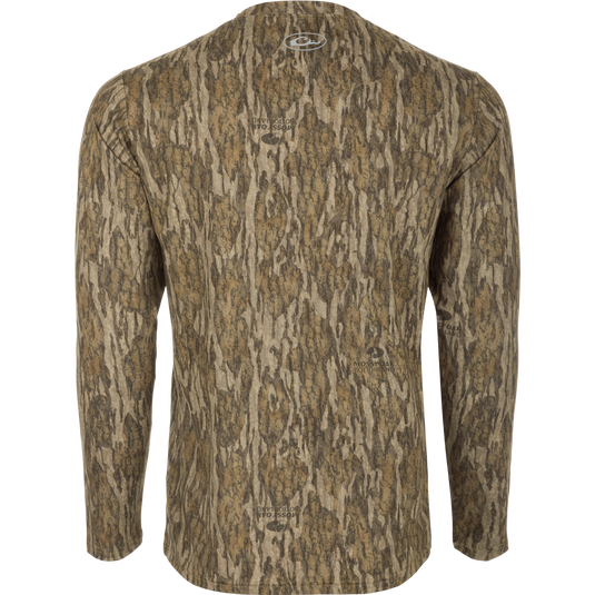 A long sleeved shirt with a tree pattern, offering comfort and protection for outdoor activities. Youth EST Camo Performance Long Sleeve Crew - Realtree.
