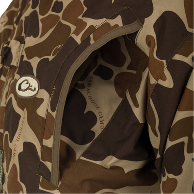 MST Waterproof Fleece-Lined Quarter Zip Jacket featuring a partial pocket view with OLD SCHOOL CAMO’s lining and an embroidered O logo patch visible.