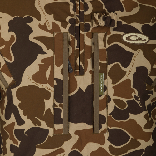 MST Waterproof Fleece-Lined Quarter Zip Jacket's camouflage front panel with vertical pockets, MAGNATTACH label visible, designed for mid-season hunting comfort and protection.
