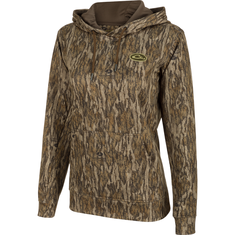 Women's MST Performance Hoodie - Realtree, a camouflage hoodie with a soft, combed fleece interior for enhanced comfort and heat retention. Double-lined hood and kangaroo pouch for wind protection and extra warmth. Improved fit and excellent stretch for increased range-of-motion. Made with 92% Polyester/8% Spandex.