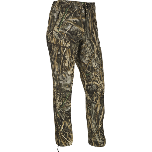 MST Softshell Waterfowler Pants - Realtree. Camouflage pants for mid-season or late-season hunts. Warm, comfortable, and versatile with secure pockets. Perfect over-pants for added warmth and protection. Exceptional freedom of movement with articulated knees and gusseted crotch. Side zips for easy on/off over boots.